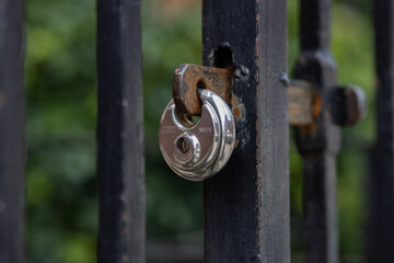 Metal padlocks on entrance gates to houses, gardens and parks, old padlocks hanging on gates, graphic art background, creative design, close up photography, Dublin, Ireland