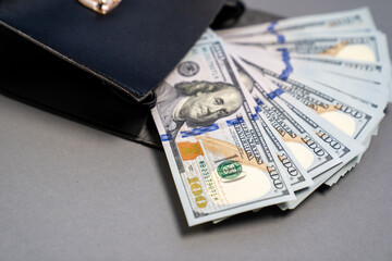 American dollar cash banknotes stack, pack of money in black bag, rich, luxury, currency, spending money in crisis, benchmark currency, most used in transactions across the world, corruption  
