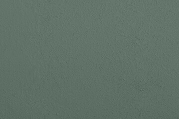Saturated pastel greenish gray colored low contrast Concrete textured background. Empty colorful...