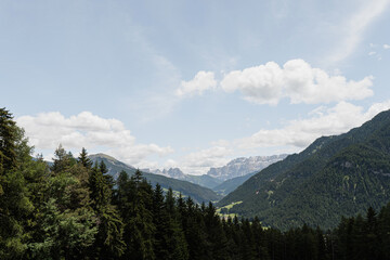 Mountain forest landscape, sky with clouds