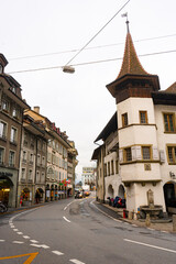 Beautiful view , medieval buildings street in old town of Thun during autumn , winter cloudy day : Thun , Switzerland : December 2 , 2019