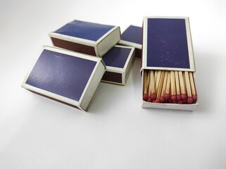 Wooden matches in a box isolated on a white background