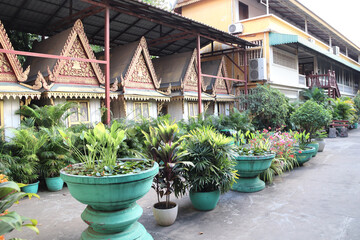 Decorative pavilion and tropical plants in pots, garden of Royal Palace complex, Phnom Penh, Cambodia