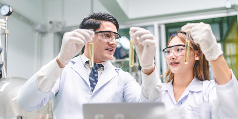 medical scientist with cannabis hemp research in medicine laboratory to make a herbal extract CBD...