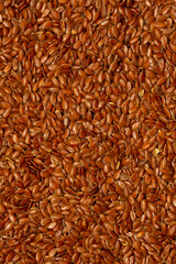 Flax seeds close-up as a background. Flaxseed for replenishment of omega 3 fatty acids. Healthy food for vegetarians.