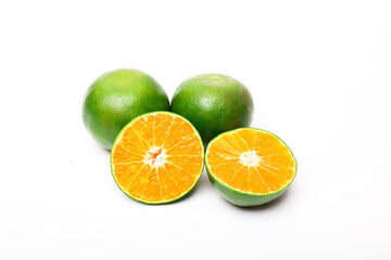 Obraz na płótnie Canvas fresh orange fruits and slices isolated on a white background
