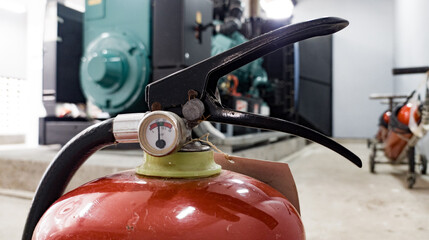 fire extinguisher is available in case of fire emergency in industrial room.