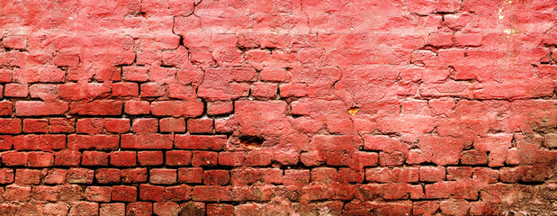 Texture of an old weathered damaged brick wall as background