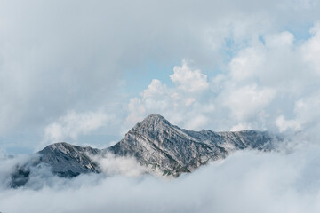 Beautiful view of mountains covered by clouds