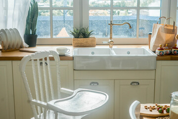 Bright spacious dining room with wooden big table