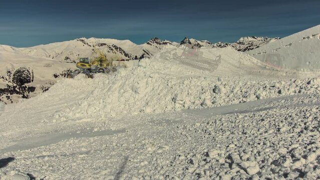 Timelapse shot of snow groomers creating snow park for Suzuki Nine Queens big air event in Serfaus, Austria