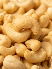 Cashew nuts as a background, top view. Cashew isolated on white background. Healthy foods.