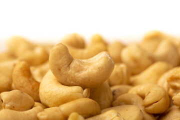 Cashew nuts as a background, top view. Cashew isolated on white background. Healthy foods.
