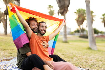 Fototapeta na wymiar Happy couple with a pride flag. LGBT community