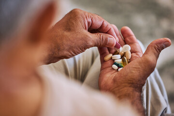 Pills, medicine and healthcare of senior man taking daily capsules for chronic illness, cancer or...