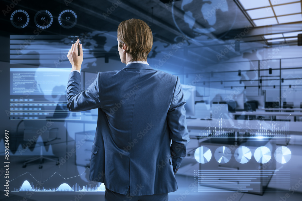 Poster back view of young businessman using abstract glowing holograhic business charts, graphs and map on 