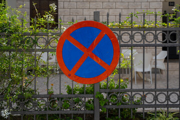 A round road sign indicating a place where vehicle parking is prohibited. tools for regulating traffic rules.