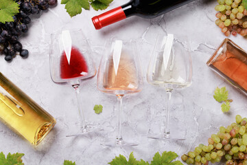 Naklejka na ściany i meble White, rose and red wine bottles and glasses