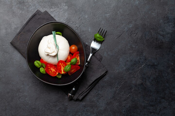 Burrata cheese, various tomatoes and olives