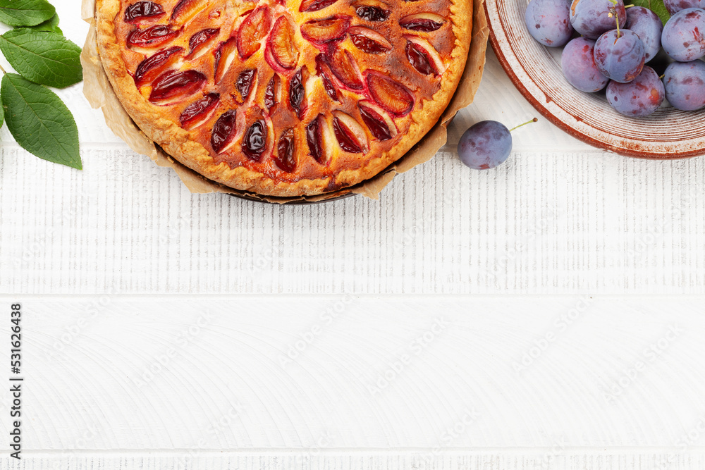 Wall mural Homemade plum pie. Fruit tart with seasonal fruits