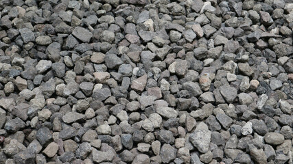 Texture of small stones (kerikil) arranged irregularly in the garden