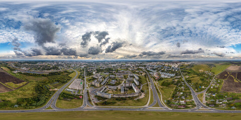aerial seamless spherical 360 hdri panorama view above road junction with traffic in city overlooking of residential area in equirectangular projection, can be used as sky replacement in panoramas
