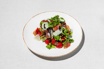 Salad with jamon and strawberries