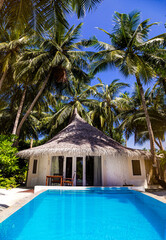 Landscape on Maldives island, luxury water villas resort with pool. Beautiful sky and ocean and...