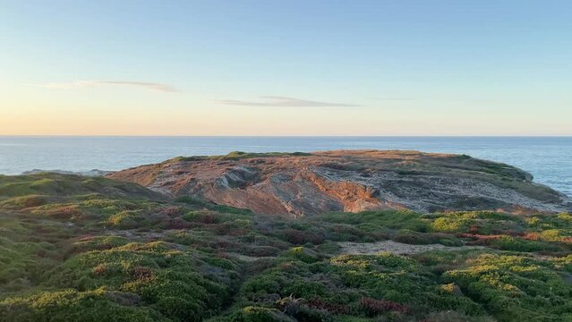 Landscape at sunset in Area Longa, Barreiros, Lugo, Galicia. Horizontal video in 4k. Sunset on the sea.