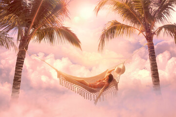 Dreamy summer screensaver with relaxed young woman relaxing in a hammock among clouds in pastel...