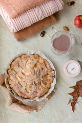Homemade apple pie on a white background near the window close-up and copy space