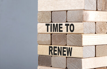 The text on the wooden blocks TIME TO RENEW