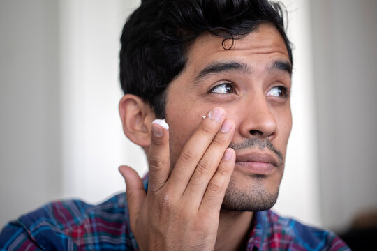 Man applying face cream
