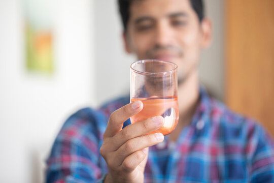 Man holding glass of water