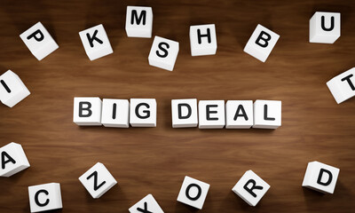 Big Deal - Business agreement.  White dice with dark capital letters on a table. Mergers and aquisitions and business concepts. 3D illustration