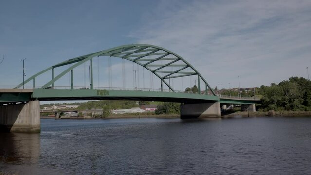 Blaydon England: 17th Sept 2022: View of Newcastle upon Tyne's Scotswood Bridge from the Tyne River in Blaydon. Sunny day with blue sky and light clouds
