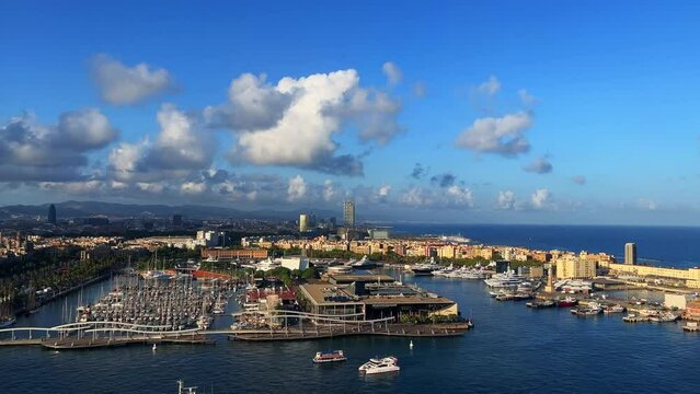 Aerial footage of Barcelona overlooking the city skyline during the day in Spain