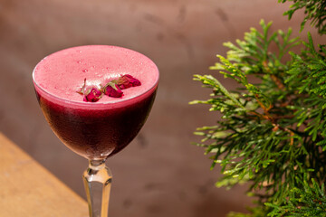 Vermouth with raspberry foam and rosebuds.