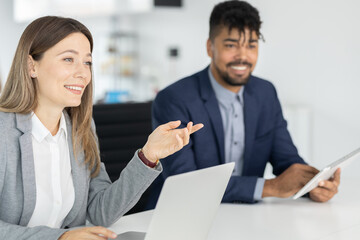 Business people on meeting, focus on business woman talking with collegue