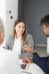 Business people on meeting, focus on business woman talking with collegue