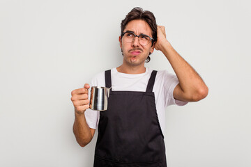 Young hispanic barista man isolated on white background being shocked, she has remembered important...