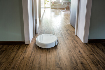 Robotic vacuum cleaner cleans tiled floor