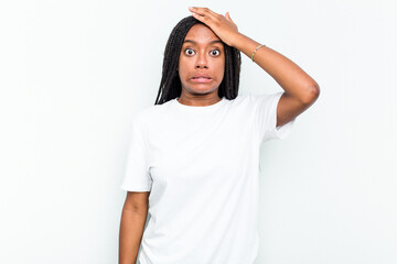 Obraz na płótnie Canvas Young African American woman isolated on white background being shocked, she has remembered important meeting.