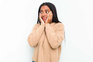 Young African American woman isolated on white background scared and afraid.