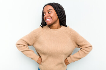Young African American woman isolated on white background laughs happily and has fun keeping hands...