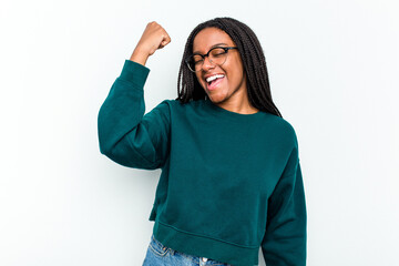 Young African American woman isolated on white background celebrating a victory, passion and enthusiasm, happy expression.