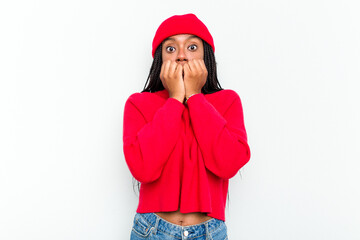 Young African American woman isolated on white background biting fingernails, nervous and very...