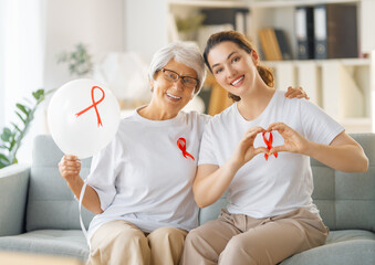 Smiling women with red satin ribbon
