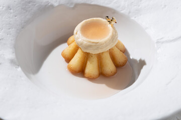 Muffin cake with cream in a white plate