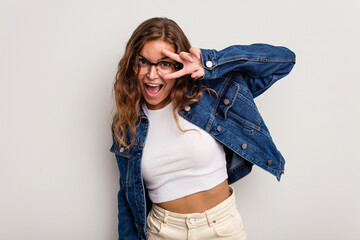 Young caucasian woman isolated on blue background dancing and having fun.